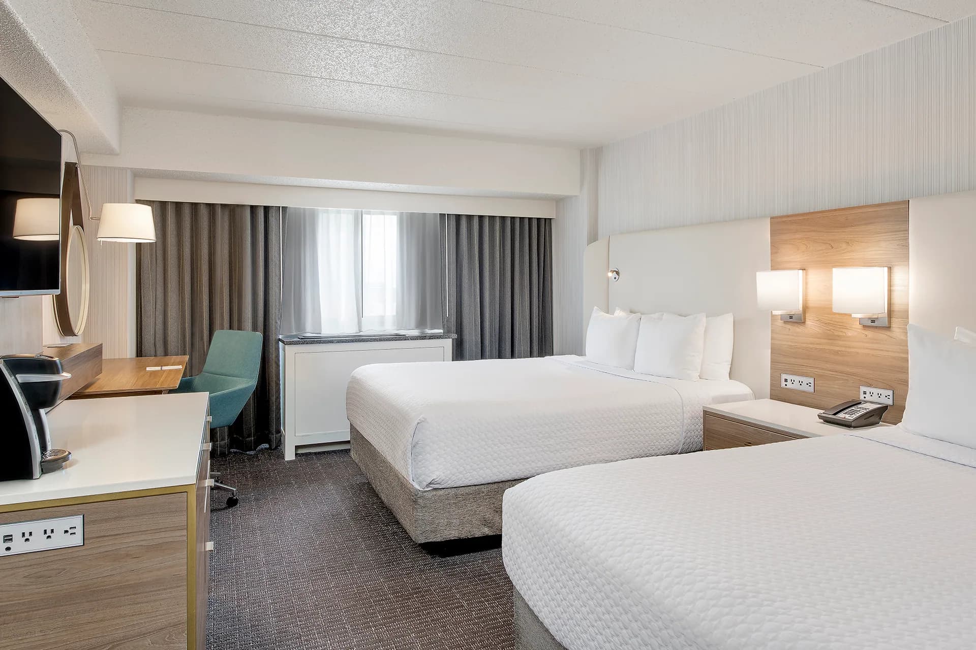 A Sonesta Columbus Downtown guest room with two queen beds