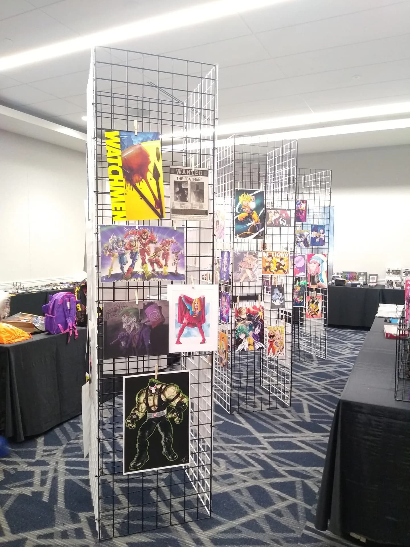 Rows of colorful original art displayed for the Matsuricon charity auction