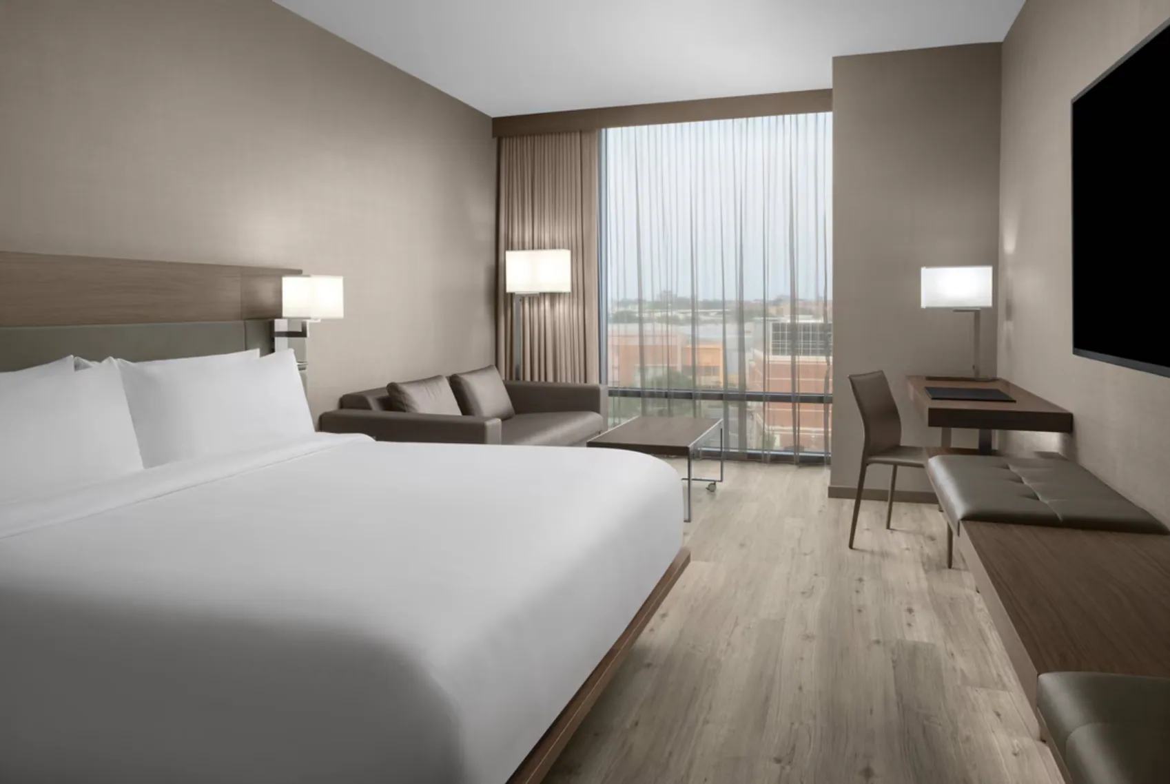 A queen guest room at AC Hotel Columbus Downtown