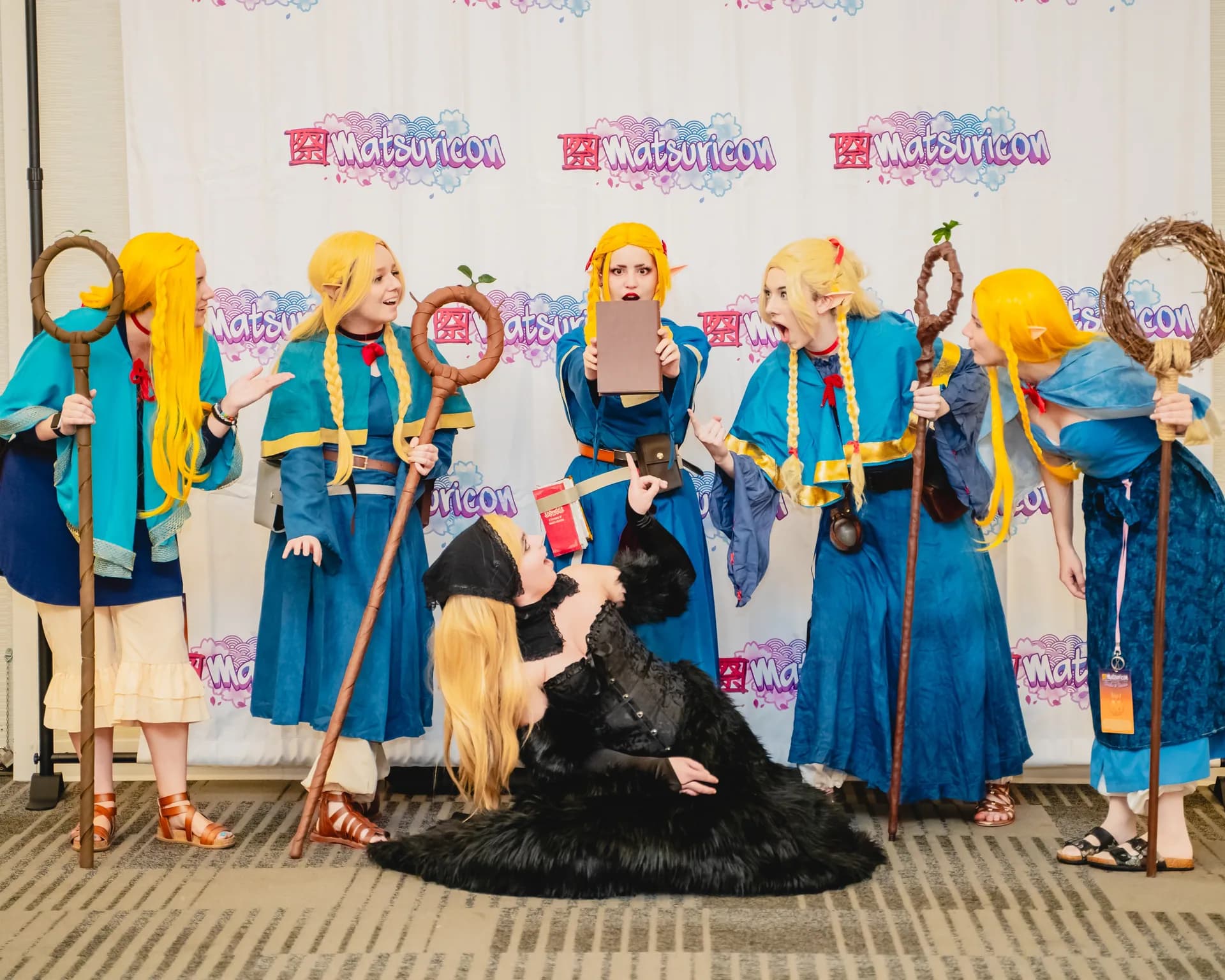 Matsuricon cosplayers posing together during a group photoshoot.
